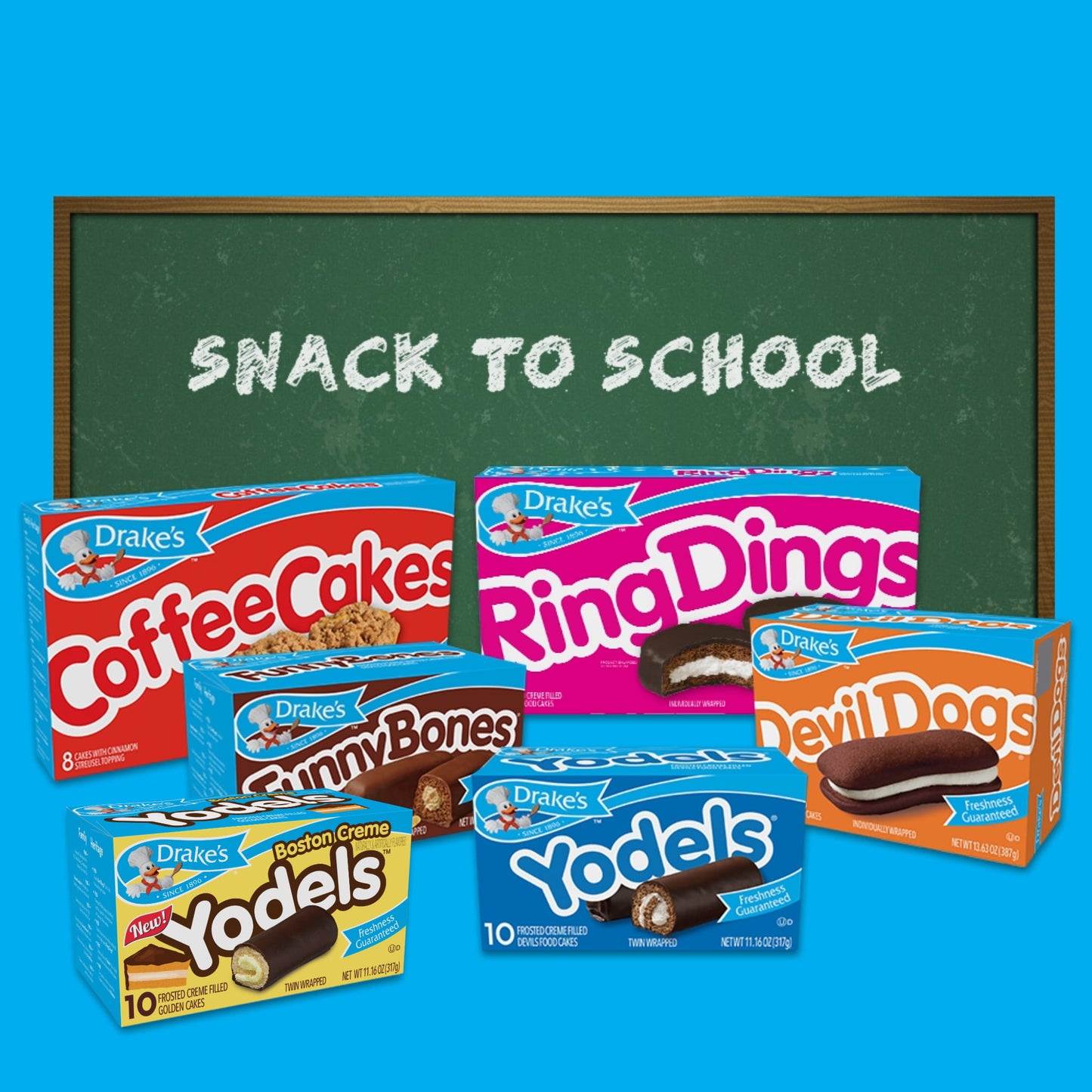 Image of Drake's Cake "Snack to School" bundle featuring six different snack cake products in front of a chalkboard that reads "Snack to School." The products included are Boston Creme Yodels, Coffee Cakes, Ring Dings, Funny Bones, Devil Dogs, and Yodels. Each product box displays the Drake's branding, and the colorful packaging contrasts with the green chalkboard background.